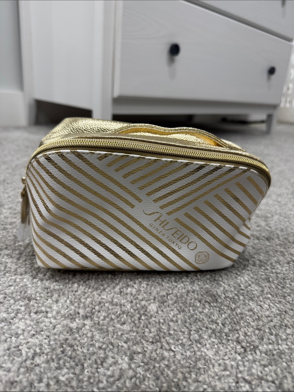 Shiseido Gold and White Striped Cosmetic Case